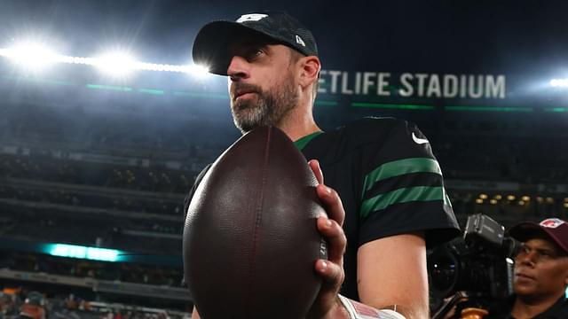 New York Jets quarterback Aaron Rodgers (8) walks off the field after the Jets win over the Houston Texans at MetLife Stadium.