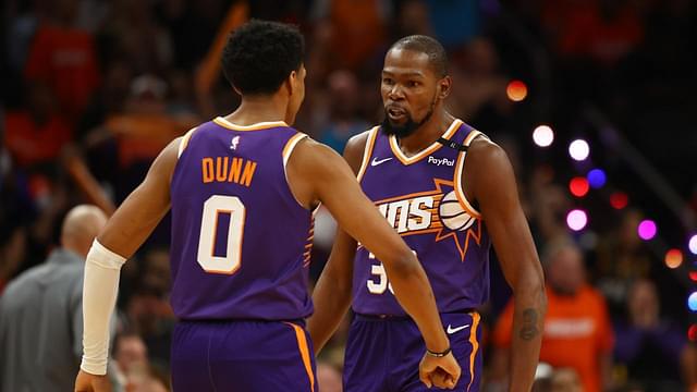 Phoenix Suns forward Kevin Durant (35) celebrates with forward Ryan Dunn (0) against the Dallas Mavericks in the second half of the home opener at Footprint Center.