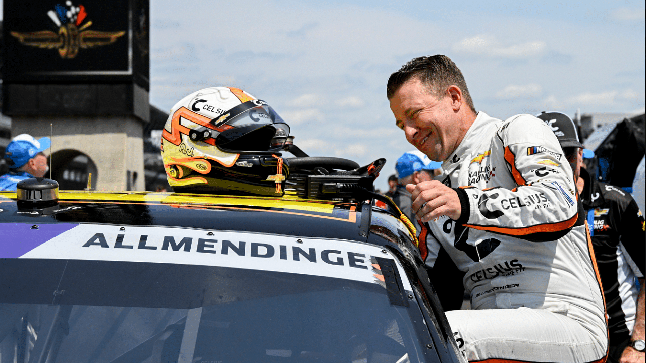 NASCAR Xfinity Series driver AJ Allmendinger climbs into his car during qualifying for the Pennzoil 250, Saturday, July 20, 2024, at Indianapolis Motor Speedway.