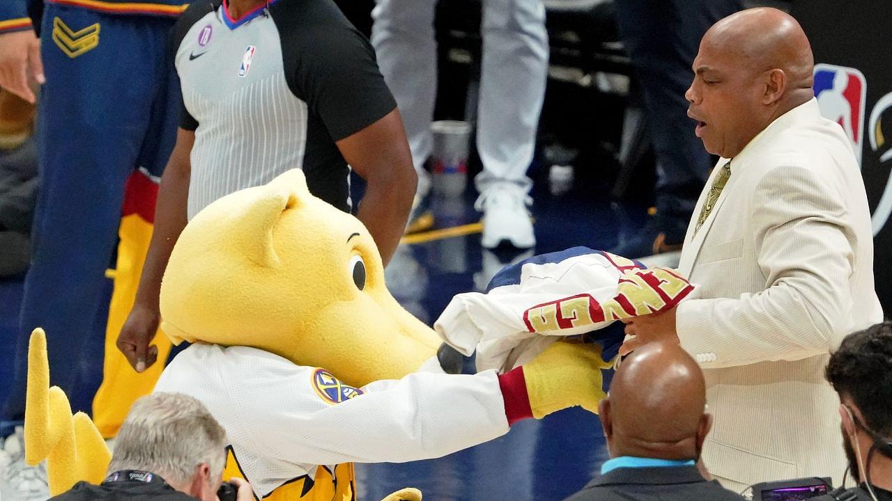 Denver Nuggets mascot Rocky shoves a signed jersey into the face of NBA former player Charles Barkley during halftime in game two of the 2023 NBA Finals between the Miami Heat and Denver Nuggets at Ball Arena.