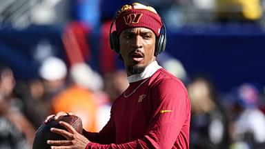 Washington Commanders quarterback Jayden Daniels (5) warms up before the game against the New York Giants at MetLife Stadium.