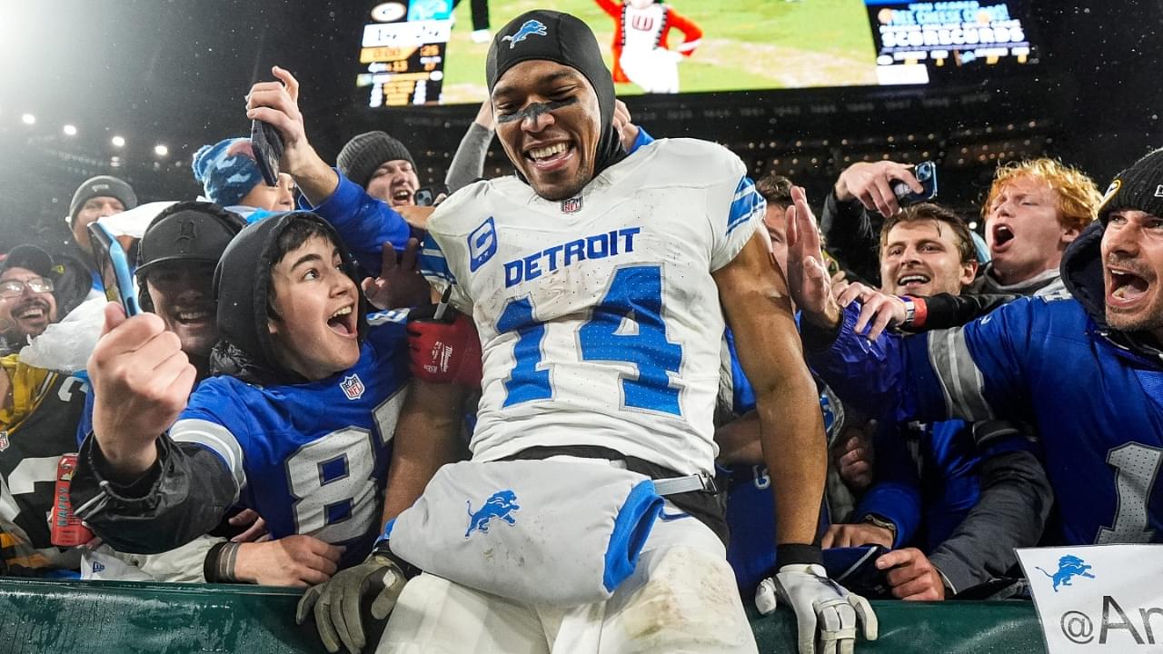 Detroit Lions wide receiver Amon-Ra St. Brown (14) leaps into Lions fans as they celebrate 24-14 win over Green Bay Packers at Lambeau Field in Green Bay, Wis. on Sunday, Nov. 3, 2024.