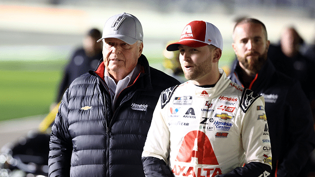 NASCAR Cup Series driver William Byron (24) and Rick Hendrick (left) walk on pit row during qualifying for the Daytona 500 at Daytona International Speedway.