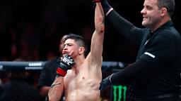 Brandon Moreno (red gloves) celebrates after defeating Amir Albazi (not pictured) in a flyweight bout during UFC Fight Night at Rogers Place.