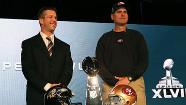 Baltimore Ravens head coach John Harbaugh (left) poses for a photo with San Francisco 49ers head coach Jim Harbaugh (right) during a press conference in preparation for Super Bowl XLVII at the New Orleans Convention Center.