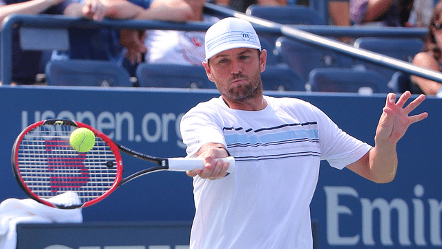 Mardy Fish of the United States returns a shot to Feliciano Lopez of Spain on day three of the 2015 U.S. Open tennis tournamen