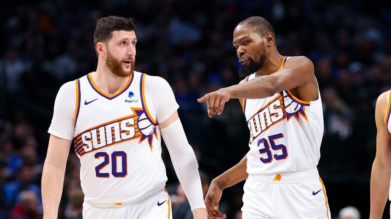 Phoenix Suns forward Kevin Durant (35) and Phoenix Suns guard Devin Booker (1) and Phoenix Suns center Jusuf Nurkic (20) talk during the third quarter against the Dallas Mavericks at American Airlines Center.