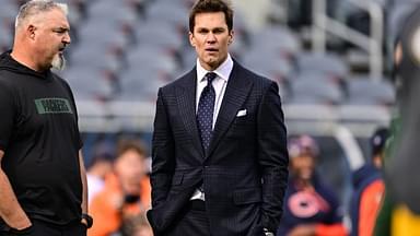 Former quarterback and current NFL announcer Tom Brady looks on before the game between the Chicago Bears and Green Bay Packers at Soldier Field.