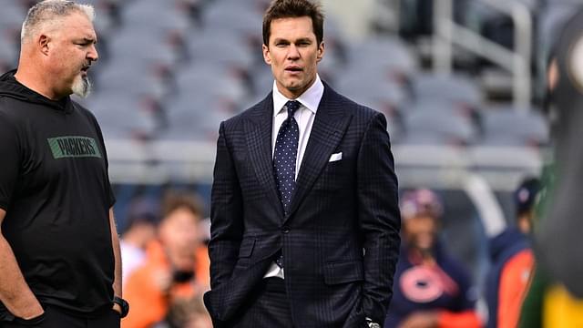 Former quarterback and current NFL announcer Tom Brady looks on before the game between the Chicago Bears and Green Bay Packers at Soldier Field.