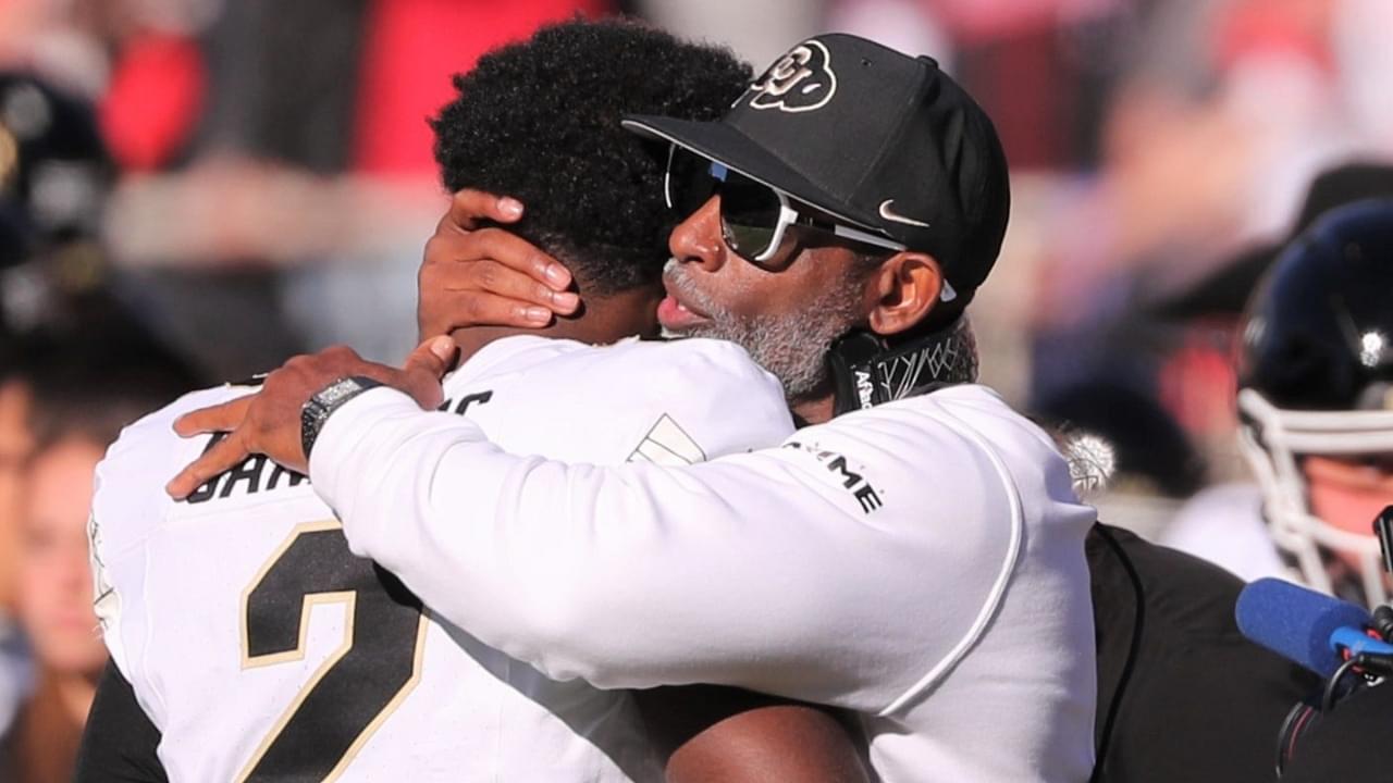 Colorado football coach Deion Sanders hugs his son, Shedeur Sanders, before facing Texas Tech in a Big 12 football game Saturday, Nov. 9, 2024, at Jones AT&T Stadium.