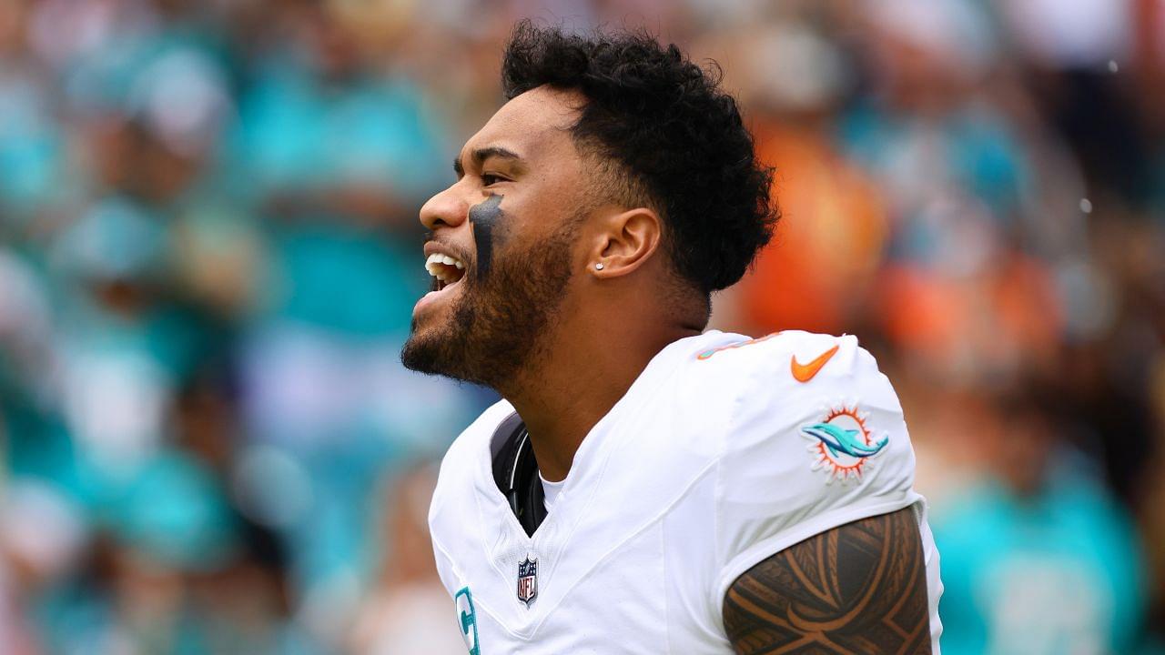 Miami Dolphins quarterback Tua Tagovailoa (1) reacts as he enters the field before the game against the Arizona Cardinals at Hard Rock Stadium.