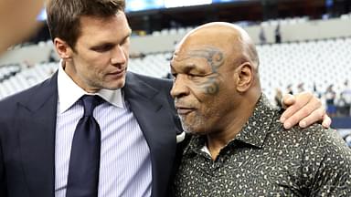 (L ro R) Fox Sports commentator Tom Brady and boxer Mike Tyson pose for a photo on the field before a game between the New Orleans Saints and Dallas Cowboys at AT&T Stadium.