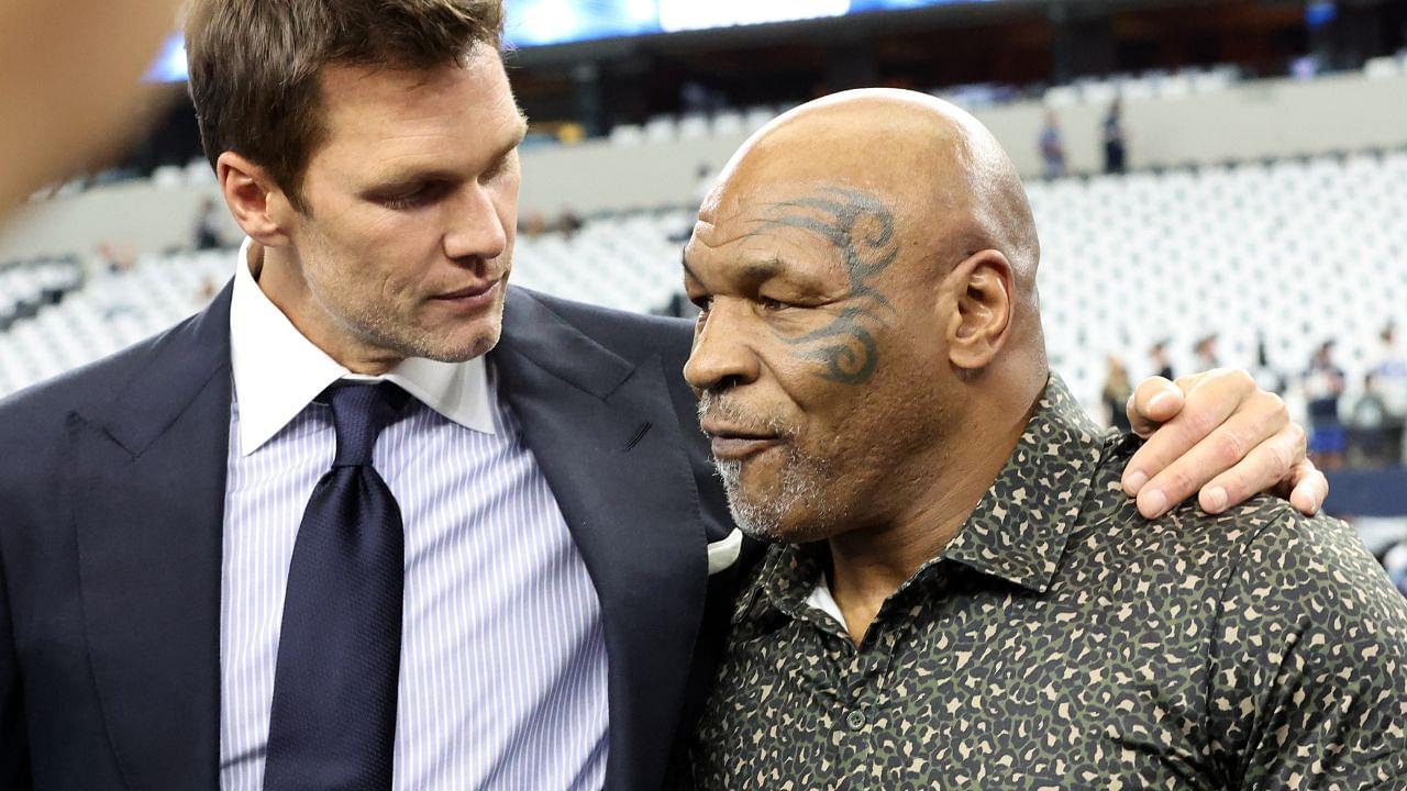 (L ro R) Fox Sports commentator Tom Brady and boxer Mike Tyson pose for a photo on the field before a game between the New Orleans Saints and Dallas Cowboys at AT&T Stadium.