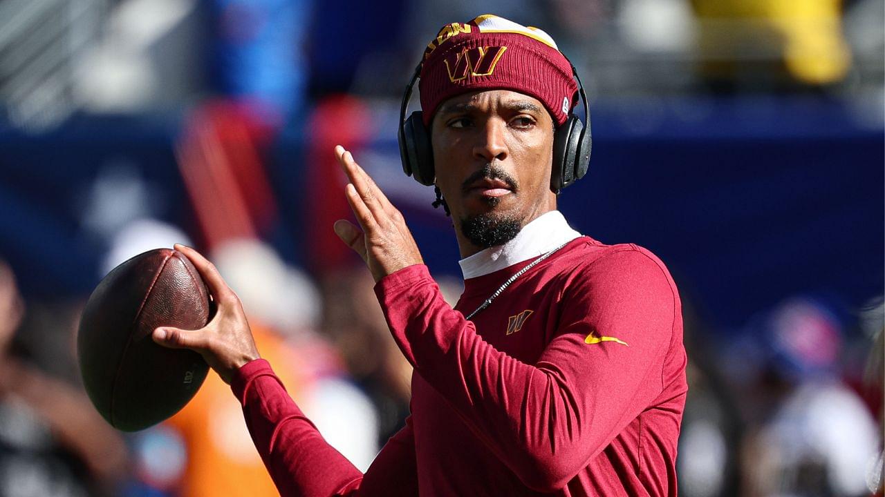 Washington Commanders quarterback Jayden Daniels (5) warms up before the game against the New York Giants at MetLife Stadium.