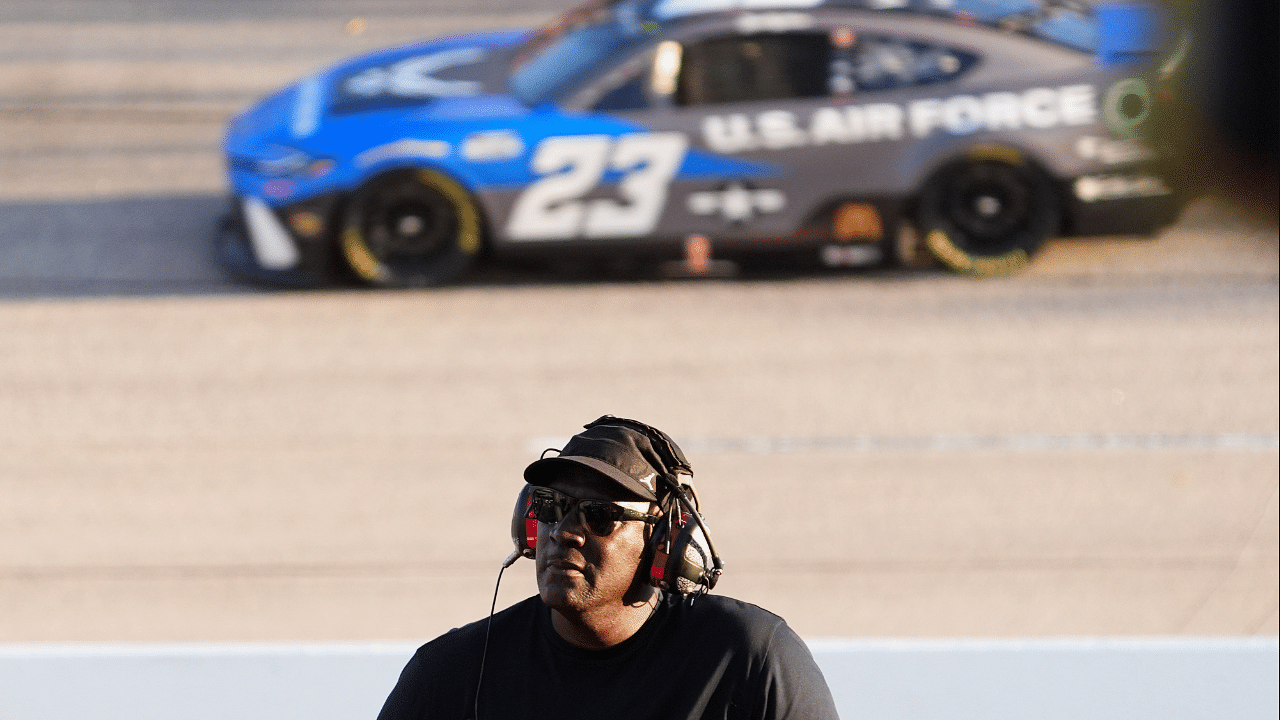 NASCAR Cup Series Team 23XI owner Michael Jordan watches a video board as NASCAR Cup Series driver Bubba Wallace (23) races during the Cook Out Southern 500 at Darlington Raceway.