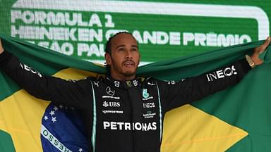 Lewis Hamilton of Great Britain and team Mercedes with the Brazilian flag to honor his hero Ayrton Senna