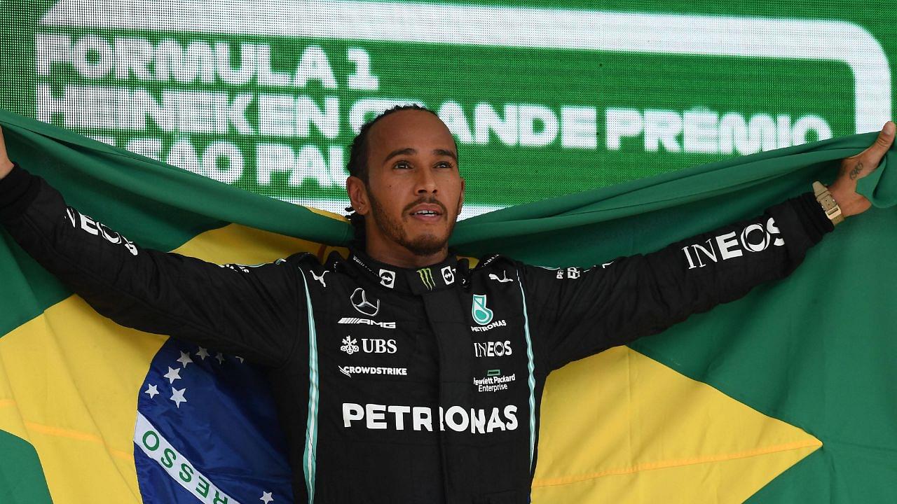 Lewis Hamilton of Great Britain and team Mercedes with the Brazilian flag to honor his hero Ayrton Senna