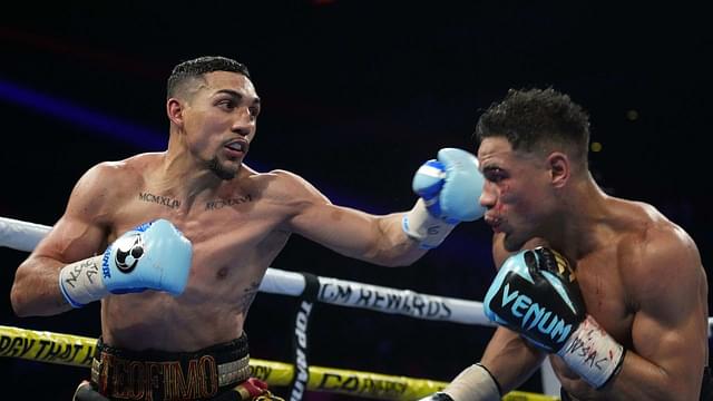 Teofimo Lopez (black/gold/red trunks) and Jamaine Ortiz (black trunks) box during their WBO Junior Welterweight World Title bout at Michelob ULTRA Arena.