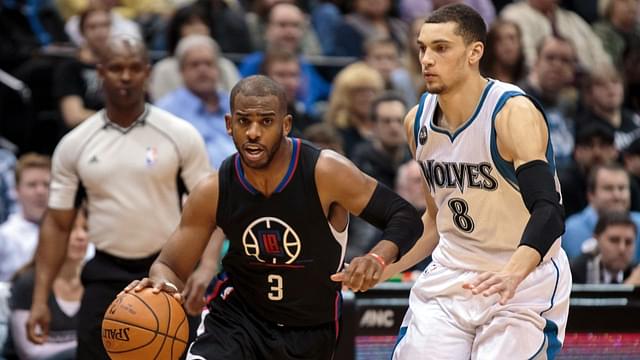 Los Angeles Clippers guard Chris Paul (3) dribbles in the second quarter against the Minnesota Timberwolves guard Zach LaVine (8) at Target Center.