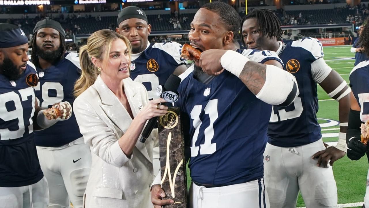 Nov 28, 2024; Arlington, Texas, USA; Dallas Cowboys linebacker Micah Parsons (11) stands with Madden Thanksgiving MVP trophy after defeating the New York Giants at AT&T Stadium.