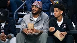 Carmelo Anthony and his son, Kiyan, watch the Don Bosco Prep Ironmen compete against the McEachern Indians in a game during the 50th annual City of Palms Classic at Suncoast Credit Union Arena in Fort Myers on Tuesday, Dec. 19, 2023. Kiyan Anthony and the Long Island Luthern Crusaders defeated Westminster Academy earlier in the day.