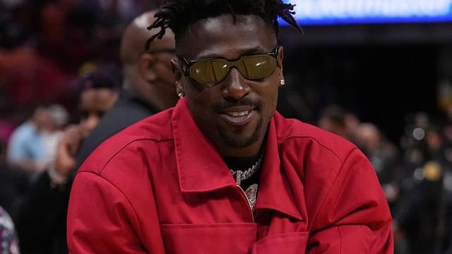 Former NFL player Antonio Brown stands on the court during halftime of the game between the Miami Heat and the Brooklyn Nets at FTX Arena.