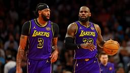 Los Angeles Lakers forward Anthony Davis (3) and forward LeBron James (23) walks to the bench during the first half against the Phoenix Suns at Footprint Center.