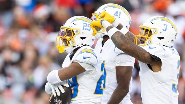 Los Angeles Chargers cornerback Tarheeb Still (29) celebrates his interception with safety Derwin James Jr. (3) and cornerback Eli Apple (41) during the fourth quarter against the Cleveland Browns at Huntington Bank Field.