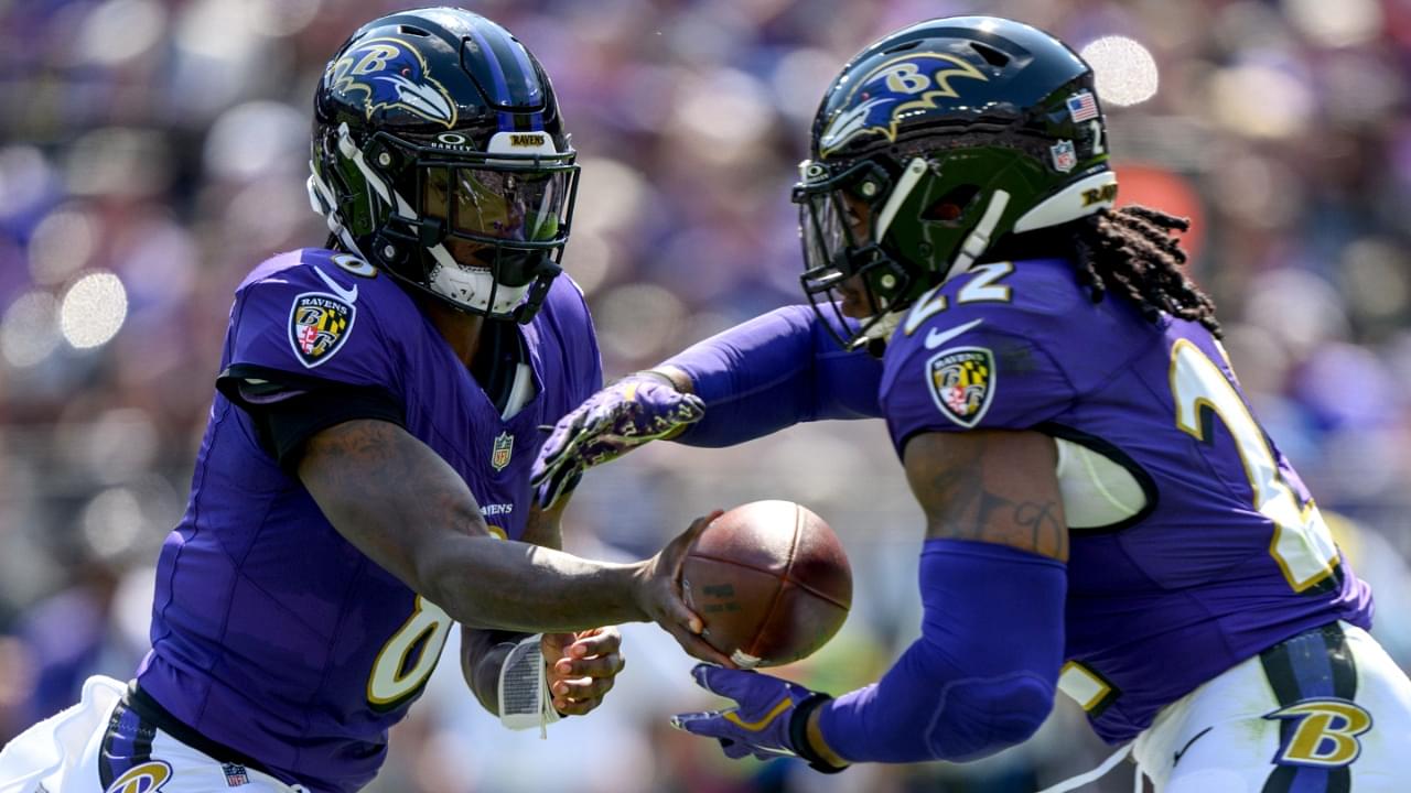 Sep 15, 2024; Baltimore, Maryland, USA; Baltimore Ravens quarterback Lamar Jackson (8) hands off to running back Derrick Henry (22) during the first half against the Las Vegas Raiders at M&T Bank Stadium.