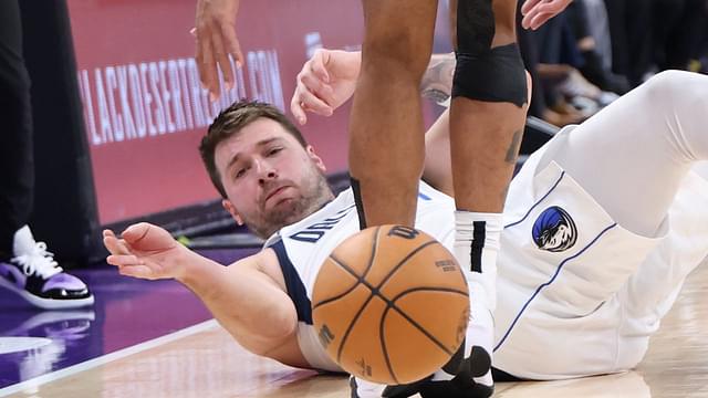 Dallas Mavericks guard Luka Doncic (77) goes to the floor for a ball against the Utah Jazz during the third quarter at Delta Center