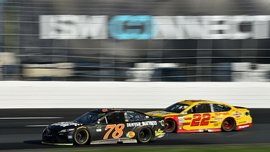 Monster Energy NASCAR Cup Series driver Martin Truex Jr. (78) laps driver Joey Logano (22) during the ISM Connect 300 at the New Hampshire Motor Speedway.