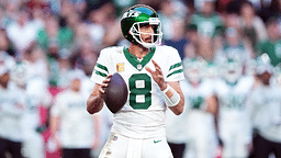 New York Jets quarterback Aaron Rodgers (8) passes against the Arizona Cardinals during the second half at State Farm Stadium.