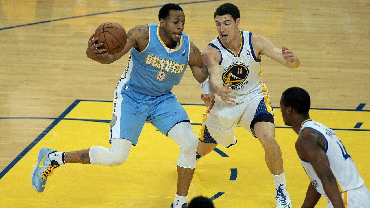 Golden State Warriors shooting guard Klay Thompson (11) defends Denver Nuggets shooting guard Andre Iguodala (9) on the drive during the first quarter of game six of the first round of the 2013 NBA Playoffs at Oracle Arena.