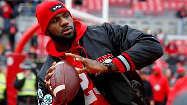 Cleveland Cavaliers player LeBron James plays catch with the Ohio State Buckeyes team before the game against the Michigan Wolverines at Ohio Stadium.