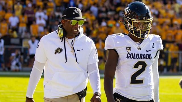 Colorado Buffaloes head coach Deion Sanders with son and quarterback Shedeur Sanders (2) against the Arizona State Sun Devils at Mountain America Stadium.