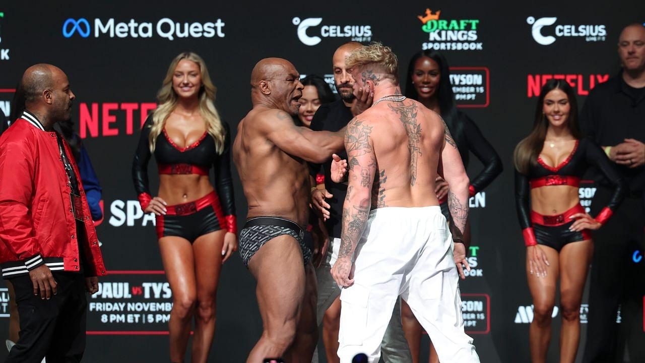 Mike Tyson (left) slaps Jake Paul (right) after weighing in at the Toyota Music Factory.