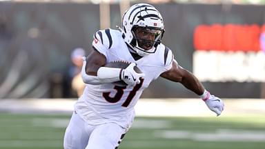 Oct 27, 2024; Cincinnati, Ohio, USA; Cincinnati Bengals running back Zack Moss (31) runs the ball as Philadelphia Eagles linebacker Zack Baun (53) defends during the third quarter at Paycor Stadium.