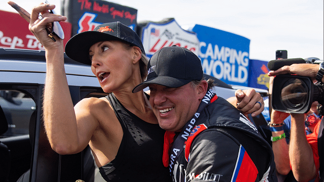 NHRA top alcohol dragster driver Tony Stewart (right) celebrates with wife Leah Pruett after winning the Four Wide Nationals at The Strip at Las Vegas Motor Speedway.