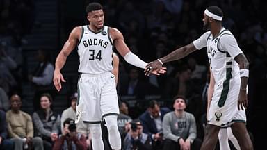 Milwaukee Bucks forward Giannis Antetokounmpo (34) slaps hands with forward Bobby Portis (9) during the first half against the Brooklyn Nets at Barclays Center.