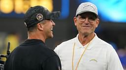 Baltimore Ravens coach John Harbaugh with brother and Los Angeles Chargers coach Jim Harbaugh before the game at SoFi Stadium.