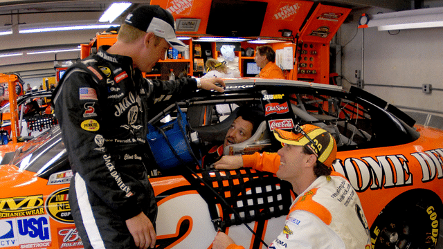 Nascar Nextel Cup Series drivers Tony Stewart (20), Clint Bowyer (07), and Kevin Harvick (29) talk prior to the start of practice for the Allstate 400 at the Brickyard, at Indianapolis Motor Speedway.