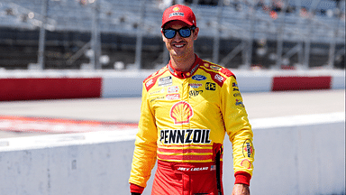 NASCAR Cup Series driver Joey Logano (22) walks down pit road prior to practice for the Cook Out Southern 500 at Darlington Raceway.