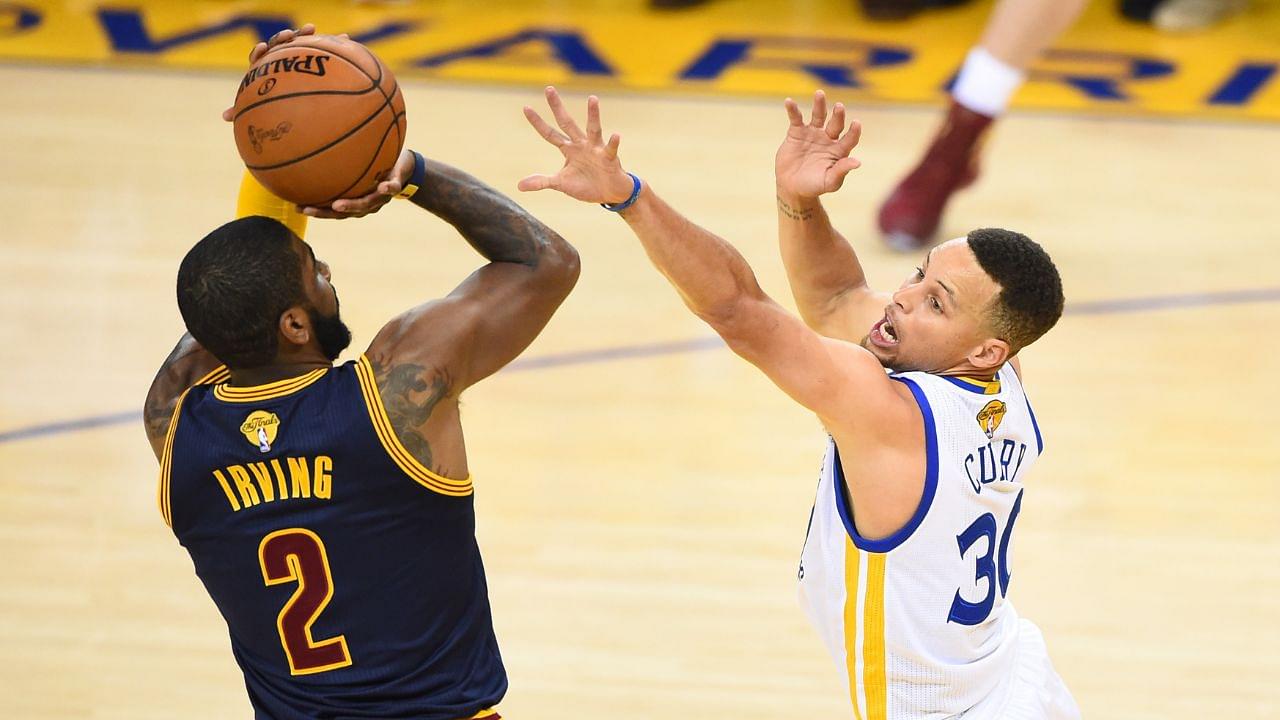 Cleveland Cavaliers guard Kyrie Irving (2) shoots against Golden State Warriors guard Stephen Curry (30) defends during the first half in game two of the NBA Finals at Oracle Arena.