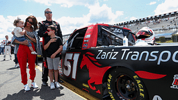 NASCAR Craftsman Truck Series driver Kyle Busch stands with his wife Samantha Busch and children Brexton and Lennix prior to the CRC Brakleen 150 at Pocono Raceway.