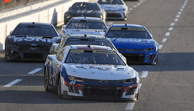 NASCAR Cup Series driver William Byron (24) leads a group into turn three during the Xfinity 500 at Martinsville Speedway.