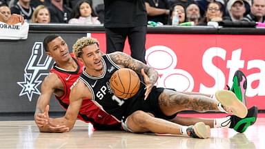 Houston Rockets forward Jabari Smith (18) and San Antonio Spurs forward Jeremy Sochan (10) battle for a loose ball during the first half at Frost Bank Center