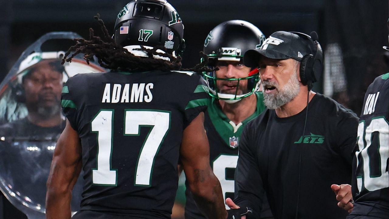 New York Jets wide receiver Davante Adams (17), quarterback Aaron Rodgers (8) and interim head coach Jeff Ulbrich celebrate Adams touchdown against the Houston Texans during the second half at MetLife Stadium.