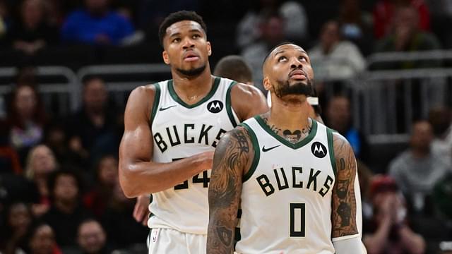 Milwaukee Bucks forward Giannis Antetokounmpo (34) and guard Damian Lillard (0) look on in the second quarter against the Chicago Bulls at Fiserv Forum.