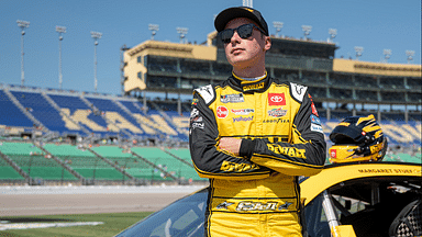 NASCAR Cup Series driver Christopher Bell (20) stands by his car before NASCAR Cup Qualifying at Kansas Speedway.