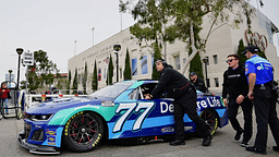 The car of NASCAR Cup Series driver Carson Hocevar (77) is brought out to the staging area during practice at Los Angeles Memorial Coliseum.